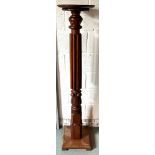 A very large mahogany torchere. 153cm h.