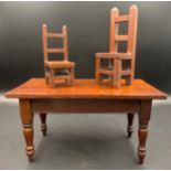 Dolls table and chairs 19thC/early 20thC. Table 30 x 17 x 16cm h.Condition ReportGood condition.