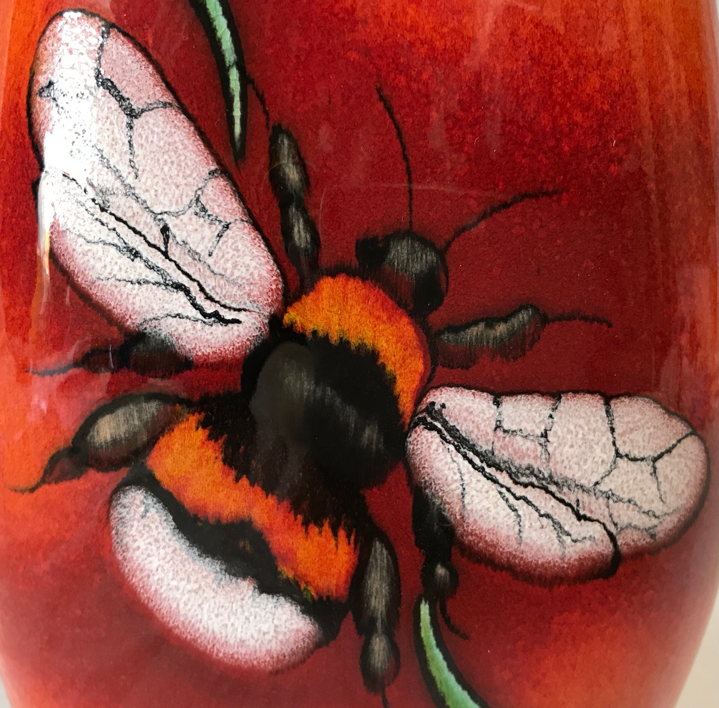 A Poole Pottery vase with Bee decoration to front on a red and orange glazed background. 25cms h. - Image 2 of 6