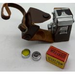 A Steky model III B vintage sub miniature film camera and case, lens cover, lens and Steky 16mm film