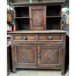 An oak dresser, 2 drawers over 2 doors to base. Single door cupboard and shelves to top. 114 w x