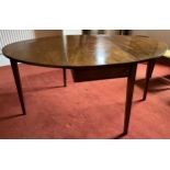 A 19thC drop leaf dining table on square tapered legs. 154.5 x 114 x 73cm h open.