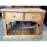 A pine 2 drawer side table. 113 w x 54 d x 86cm h.Condition ReportCracks to wood in both sides.