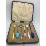 Boxed set of six enamel and .925 silver spoons.Condition ReportTiny chip to white spoon.