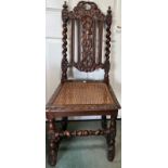 A carved oak single chair with cane seatCondition ReportLoose back