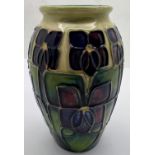 A Moorcroft tube lined decorated vase 10.5cm h.Condition ReportGood condition.