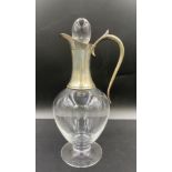 A silver mounted glass claret jug of baluster form with silver spout, neck and handle, maker J A