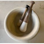 A large chemist's pestle and mortar with spare pestle. 29cm d x 14cm h.Condition ReportSlight