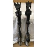 Pair of tall African carved ebony wooden figures with embossed brass and metal decoration, 104cm h.