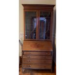 Edwardian mahogany inlaid bureau bookcase. Glazed 2-door bookcase over 4 graduated drawers. 91cms