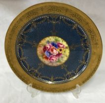 Royal Worcester plate signed J Stanley, 27cm d. Depicting flowers to the centre and raised