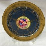 Royal Worcester plate signed J Stanley, 27cm d. Depicting flowers to the centre and raised