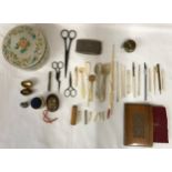 Selection of needlework items to include needle holders, snips, scissors, crochet hooks, pin