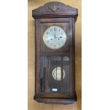 Oak wall mounted clock max height 78cms x max width 35cms x max depth 16.5cms.Condition ReportAge