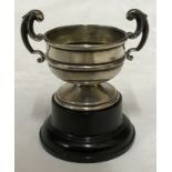 A small silver trophy with black plastic base, Birmingham 1936 measures 5.5cms h x 8cms w and