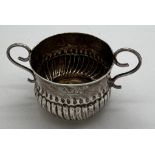 A Queen Anne miniature porringer 4cm d x 3cm h with spiral fluting and wirework handles, London