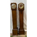 Two wooden grandmother clocks believed to be in working order both 140cms high x 18cms deep one
