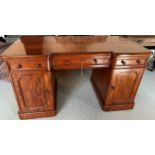 A Victorian pedestal desk, veneered both sides, cross banded. 137 w x 70 d x 76cm h.Condition