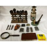 Smoking ephemera to include 7 pipes and rack, a Wade ceramic dog pipe holder, 8 lighters (various