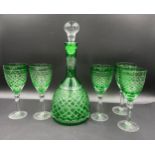 A 20thC green and clear cut glass set comprising a decanter 35cm h and 5 x wine glasses 20cm h.