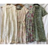 A selection of vintage dresses to include a green button front dress size 40, grey and multi