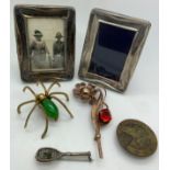 Two silver frames, Birmingham 1923, together with three brooches, two silver and one brass and a