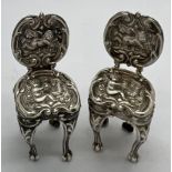 A pair of miniature silver chairs. Birmingham 1902, maker Levi & Salaman. 4cm h.Condition