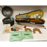 Violin (in need of restoration) and case along with a round tin. Round tin contains spares for