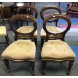 Four 19thC mahogany balloon back upholstered dining chairs.