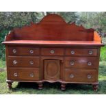 Mahogany dresser on turned legs, drawers and cupboard to centre. 188.5 x 56 d x 153cm to back.
