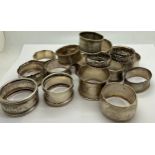 Seventeen hallmarked silver napkin rings with various dates and makers. Total weight 260gm.Condition
