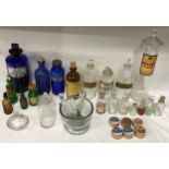 Chemistry and concentrated food essence bottles and pill boxes. Blue, green and clear chemist