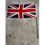 A United kingdom flag on pole. Flag 70 h x 130cm w.