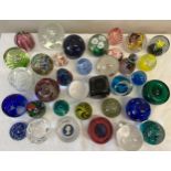 A large quantity of paperweights to include Urdale, Wedgwood, Caithness, Mdina, Murano and others.