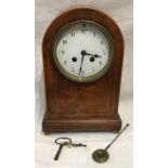 An Edwardian inlaid mahogany mantle clock with enamel face, Arabic numerals and French made