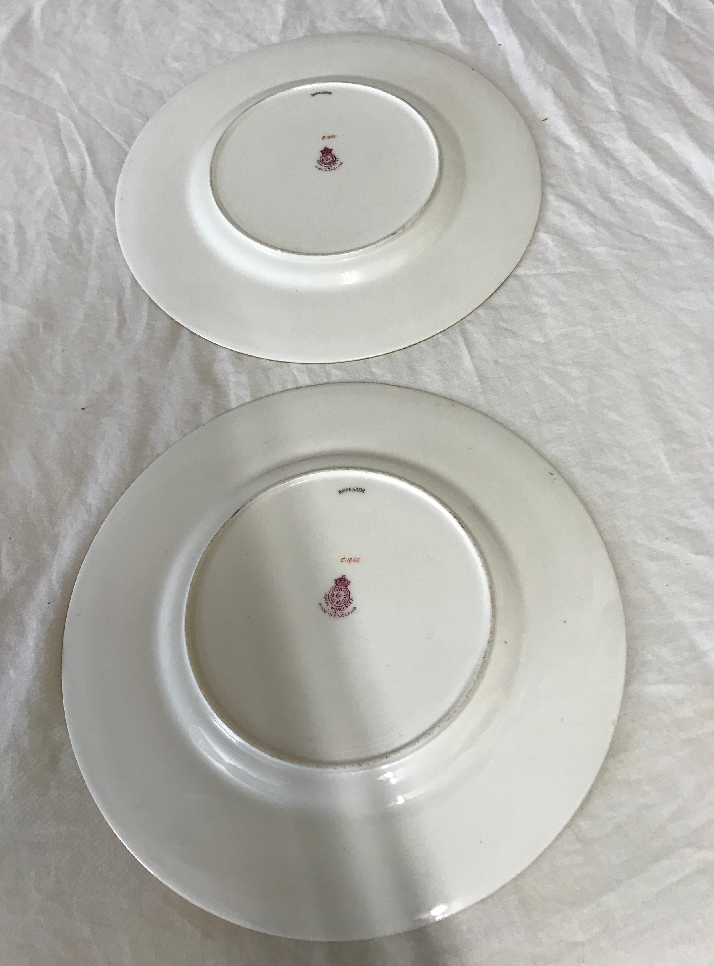 Pair of hand painted Royal Worcester plates signed E Phillips, 27cm d. Depicting flowers to the - Image 2 of 2