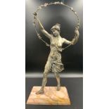 A silvered bronze semi clad female with floral hoop on a peach, signed to base G Obiols. 59cm h.