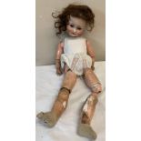 Schoenau and Hoffmeister 1909 bisque headed doll with brown sleeping eyes and open mouth. 60cm h.
