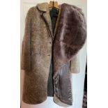 A vintage sheepskin coat and fur stole with leather trim.Condition ReportGood condition.