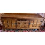 Peter Heap Rabbitman, An Oak Panelled Sideboard, with raised upstand above two cupboard doors