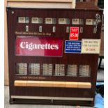 A large cigarette dispensing machine. 82 w x 88cm h.