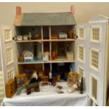 A 3 storey dolls house and contents. 80 h x 62cm w x 32cm d.Condition ReportRestoration required.