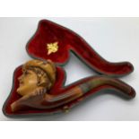 A well patinated meerschaum pipe with figural female head, amber mouth piece and hallmarked engraved