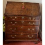 An oak bureau with brass drop handles and fitted interiors. 75.5 w x 44 d x 99cm h.Condition