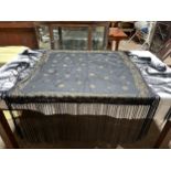 A vintage black silk fringed shawl with gold decoration. 94cm square without fringing.Condition