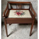 Edwardian mahogany inlaid piano stool with lift up seat and woolwork cover. 65 h x 51cm w.