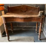 A 19thC pine serpentine front washstand with vice attached, 106 x 55 x 79cm.