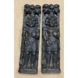 Two very heavy cast iron plaques, depicting two Gentlemen in relief. 57 h x 16cm w.Condition