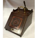 A Mahogany Coal Scuttle with brass handle, knob and shovel.Condition ReportNo liner, fairly good