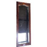 A mahogany framed bevel edged wall mirror. 79 x 26cm.